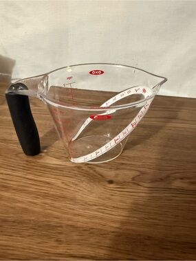Oxo Clear Plastic Measuring Cup with Black Handle and Red Markings